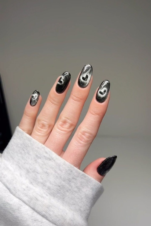Black cat-eye nails, edgy nail art, Pinterest trend