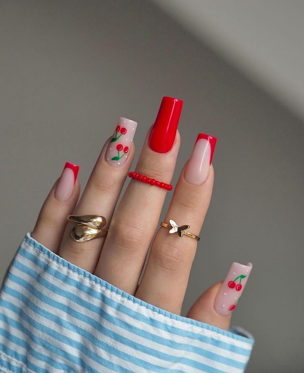 Long red square nails with cherry accents