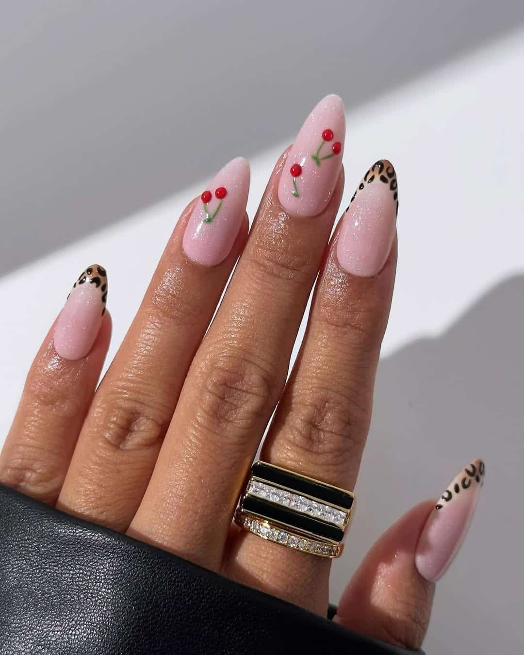 Almond nails with cherry and leopard tips