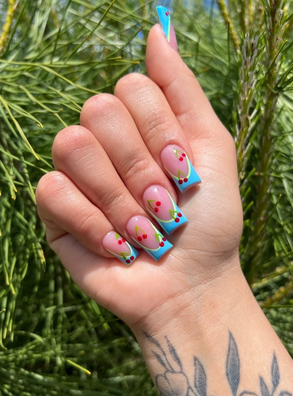 Square nails with blue and cherry French tips