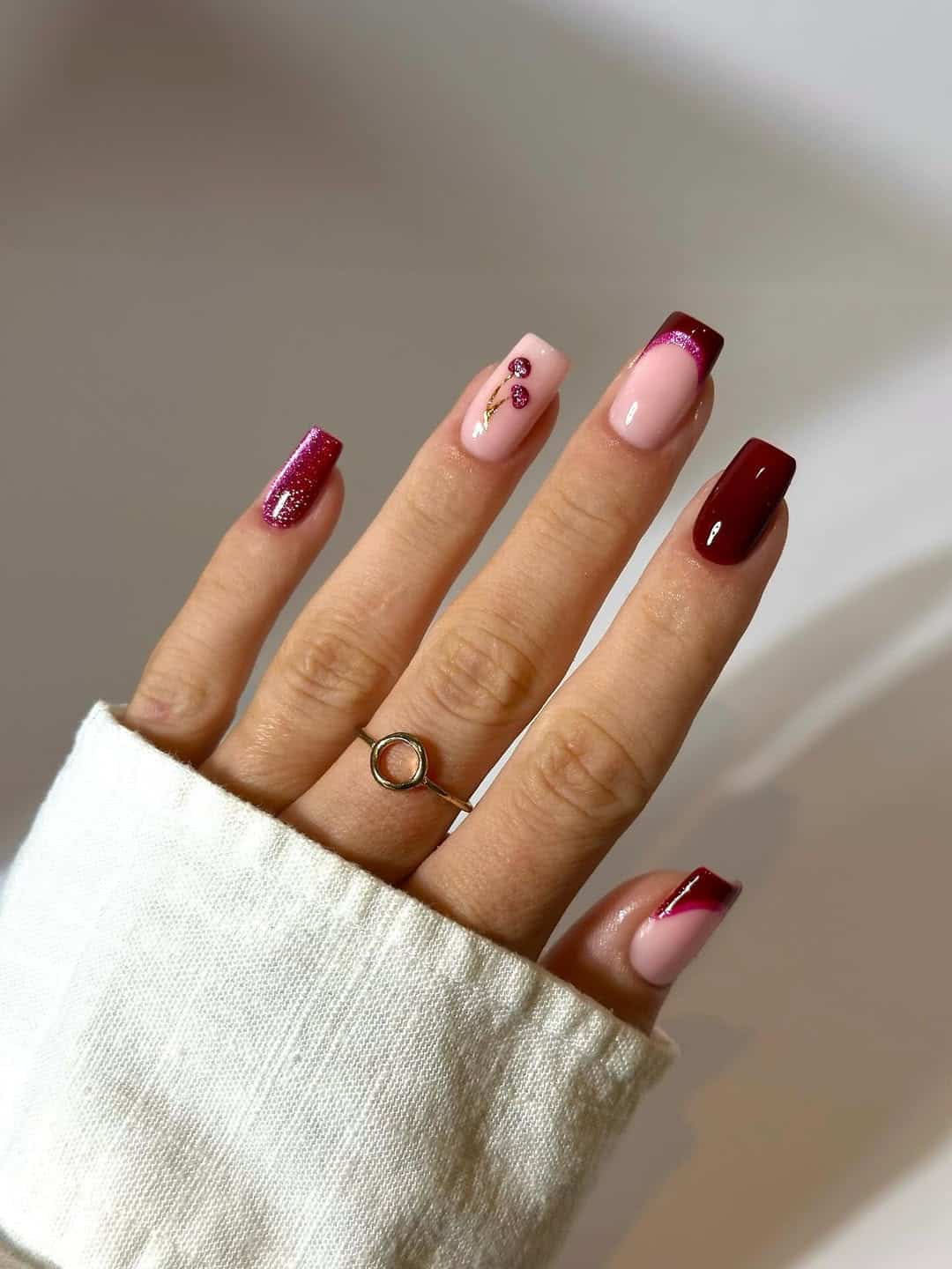 Square nails with burgundy gradient and cherry art