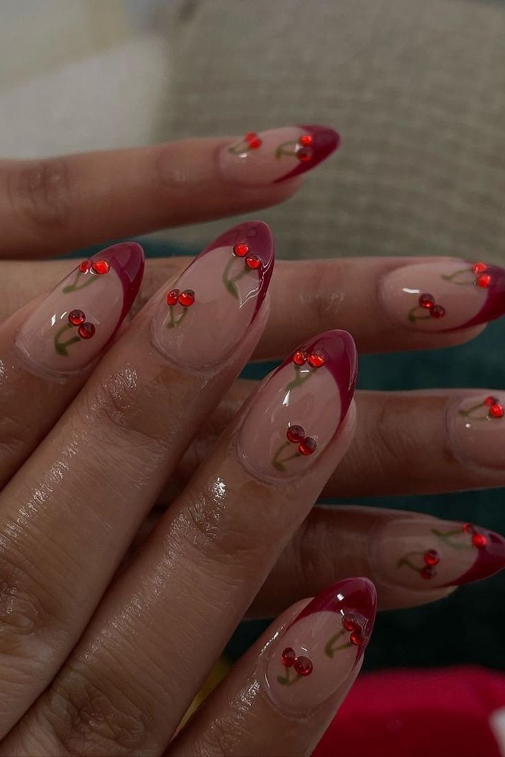 Almond nails with red tips and cherry art