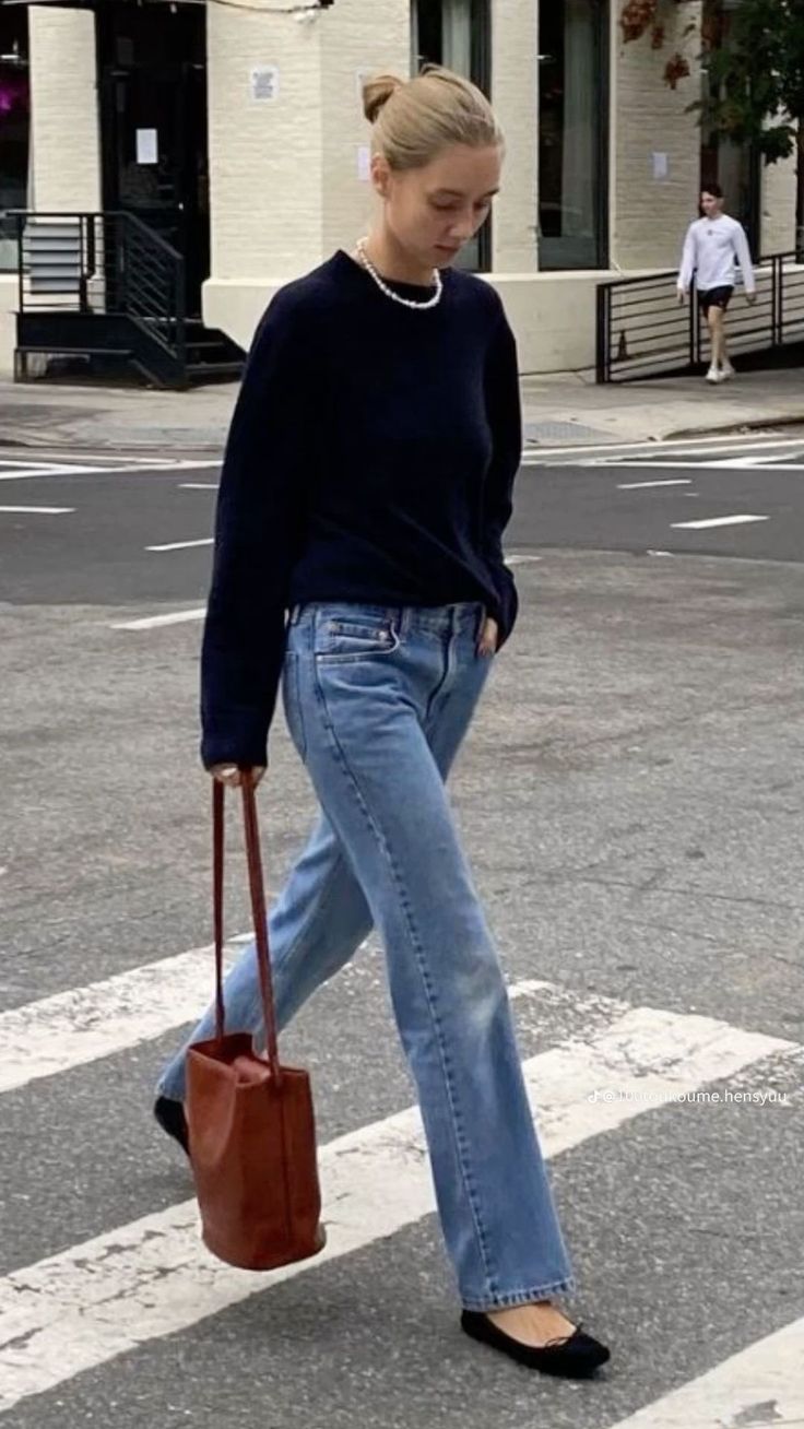 Navy sweater with jeans and flats