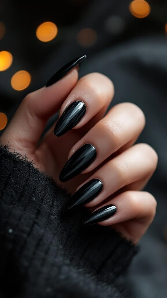Glossy black almond nails, sleek fall elegance.