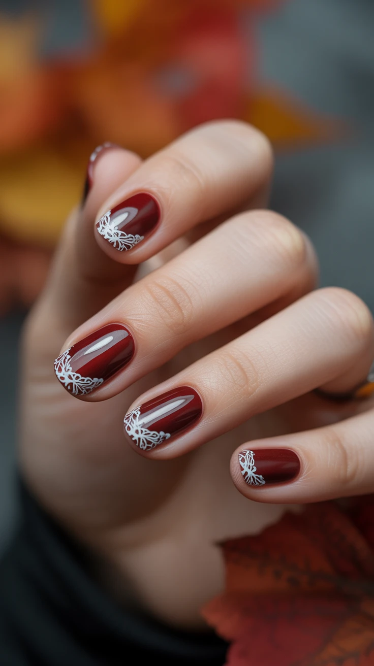 Burgundy nails with lace French tips, romantic fall look.