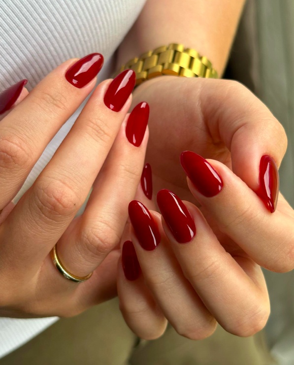 Timeless red nails, almond shape, glossy finish, modern twist