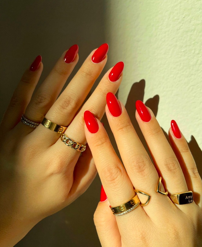 Fiery red nails, almond shape, bold and striking