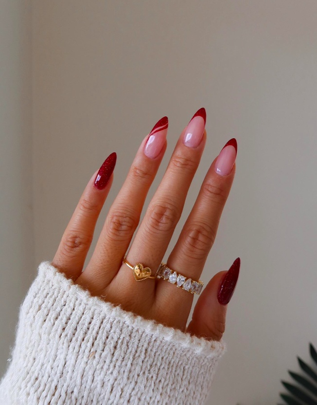 Diagonal red tip nails, almond shape, creative twist