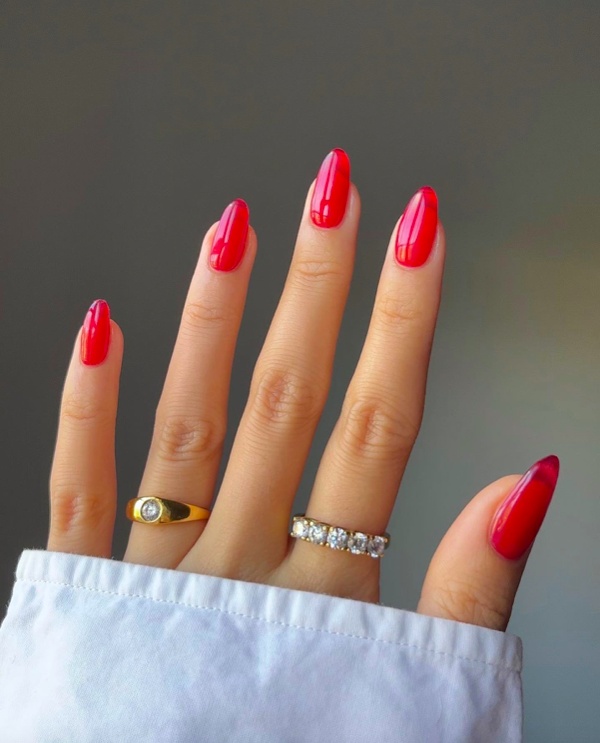 Bold scarlet oval nails, glossy, vibrant finish
