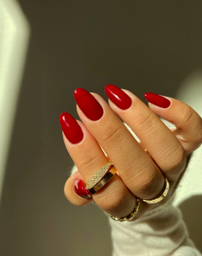 Classic crimson oval nails, glossy, timeless appeal