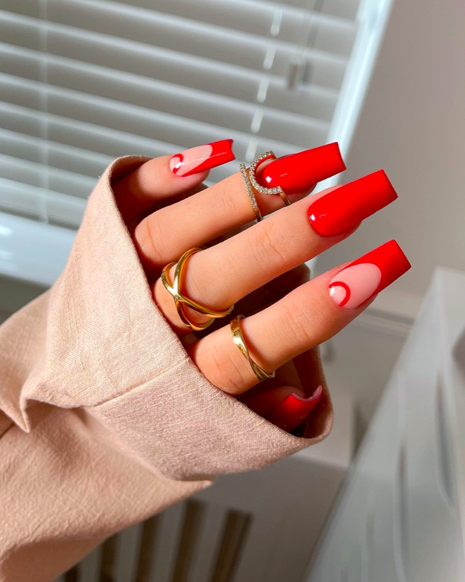 Bold red coffin nails, glossy, dramatic look