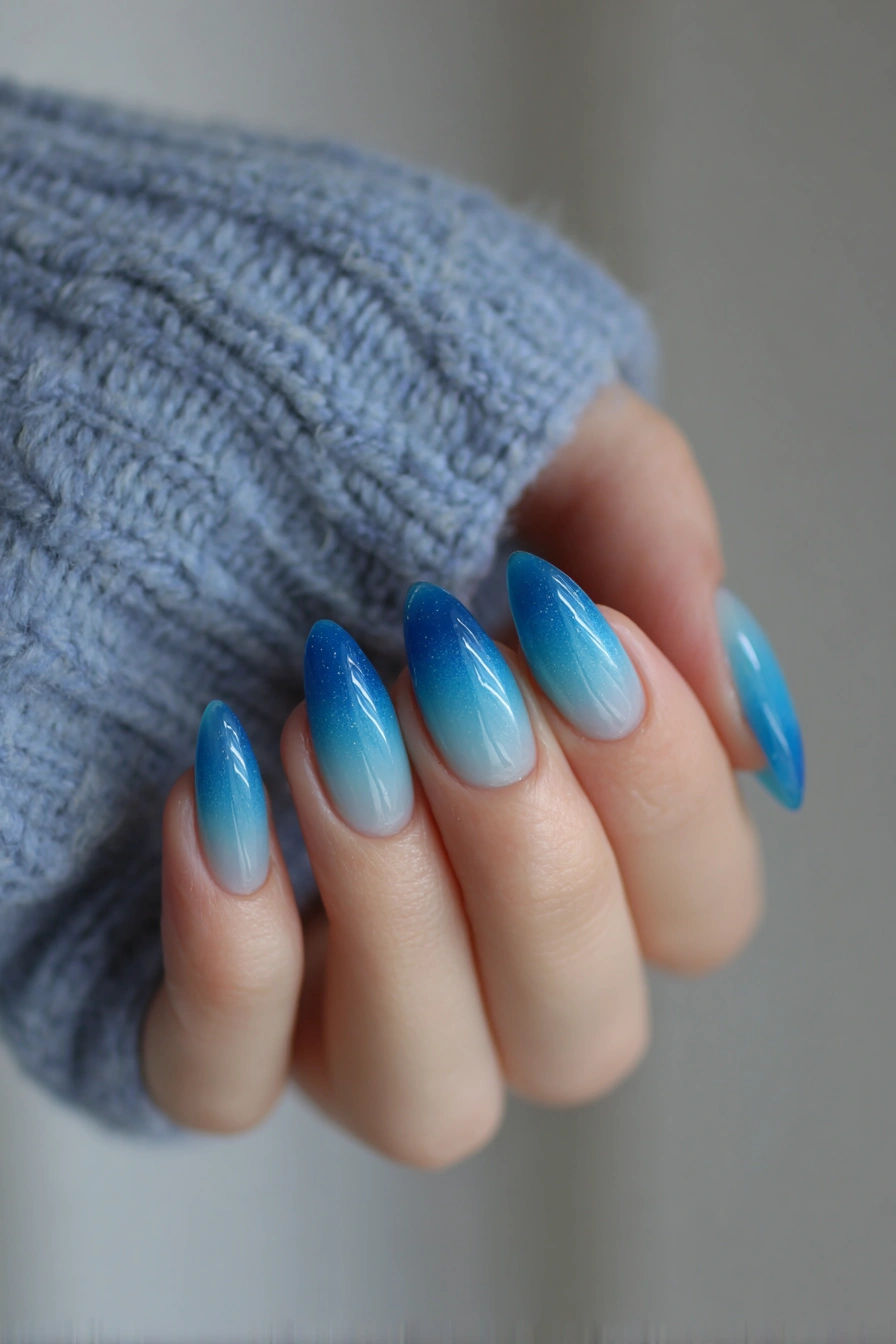 Blue ombre almond nails, serene elegance