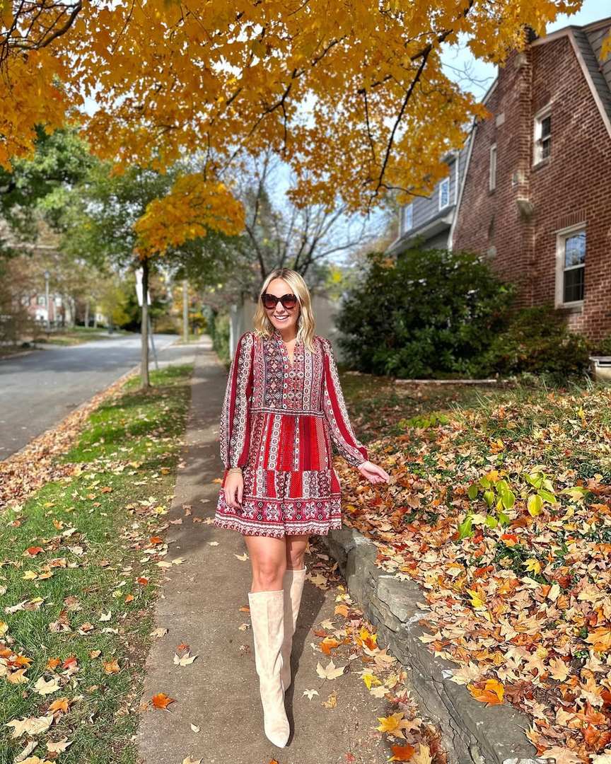 Red patterned dress with knee-high boots