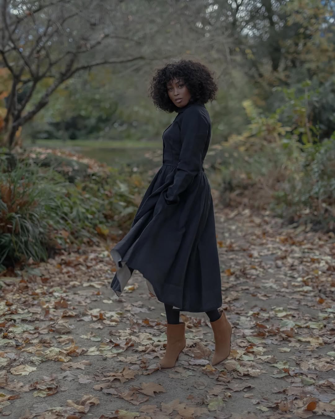 Flowing black dress with brown boots