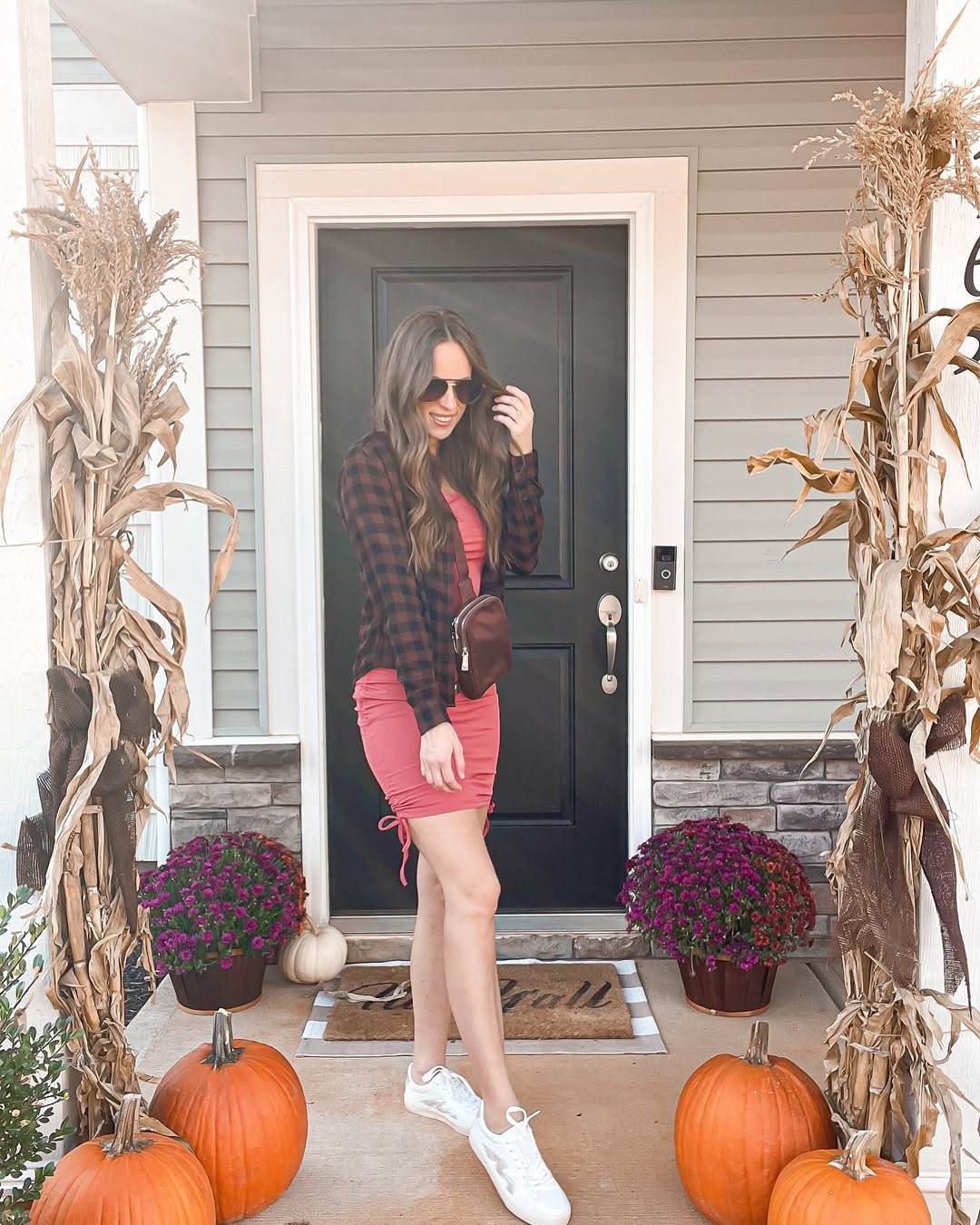Pink dress with plaid shirt and sneakers