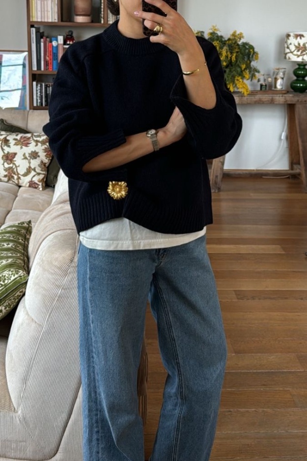 Chunky knit sweater paired with denim jeans