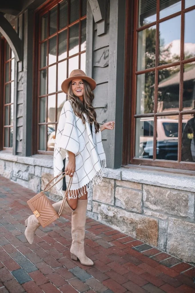 Fringe poncho with suede boots