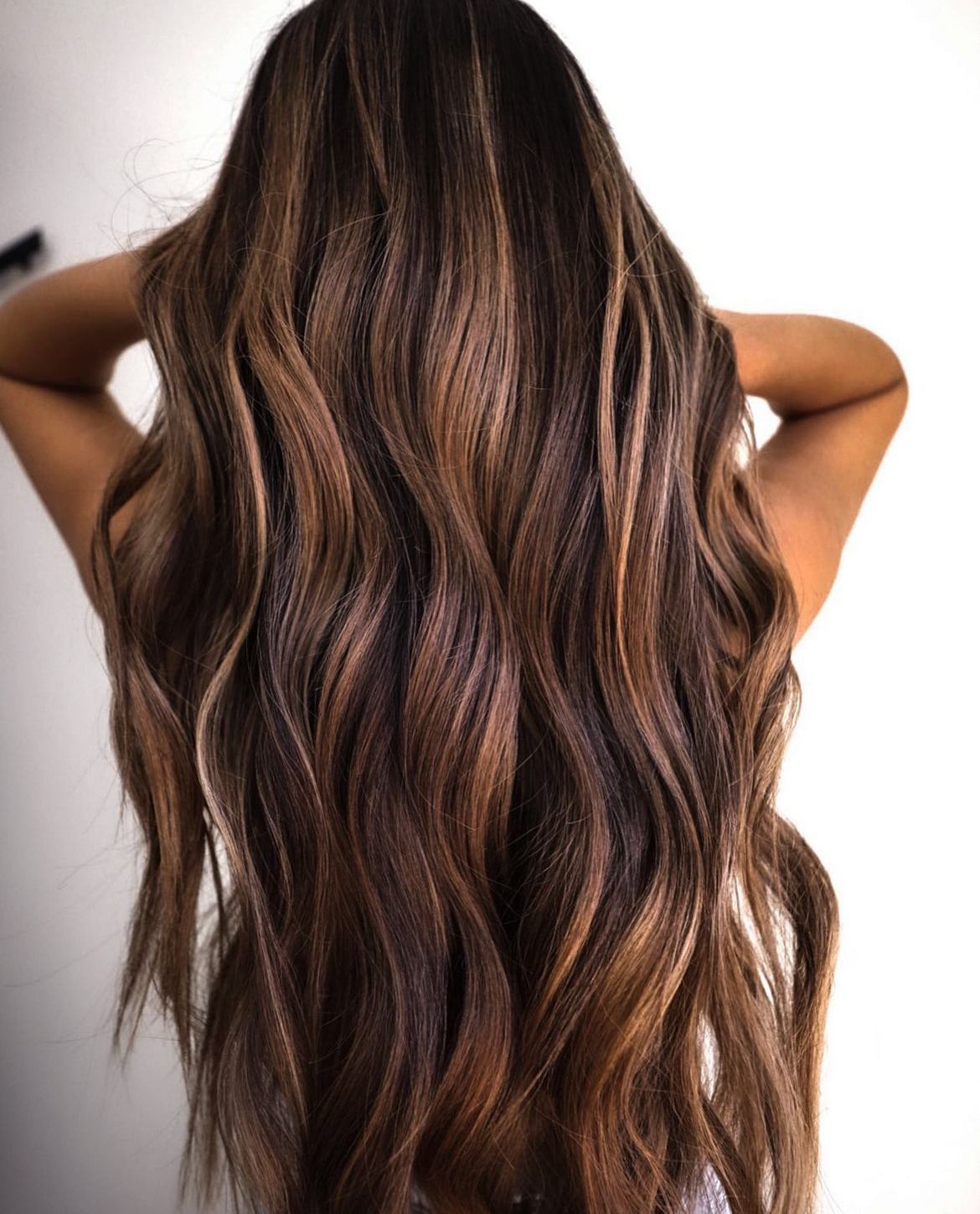 Long brunette hair with sun-kissed highlights