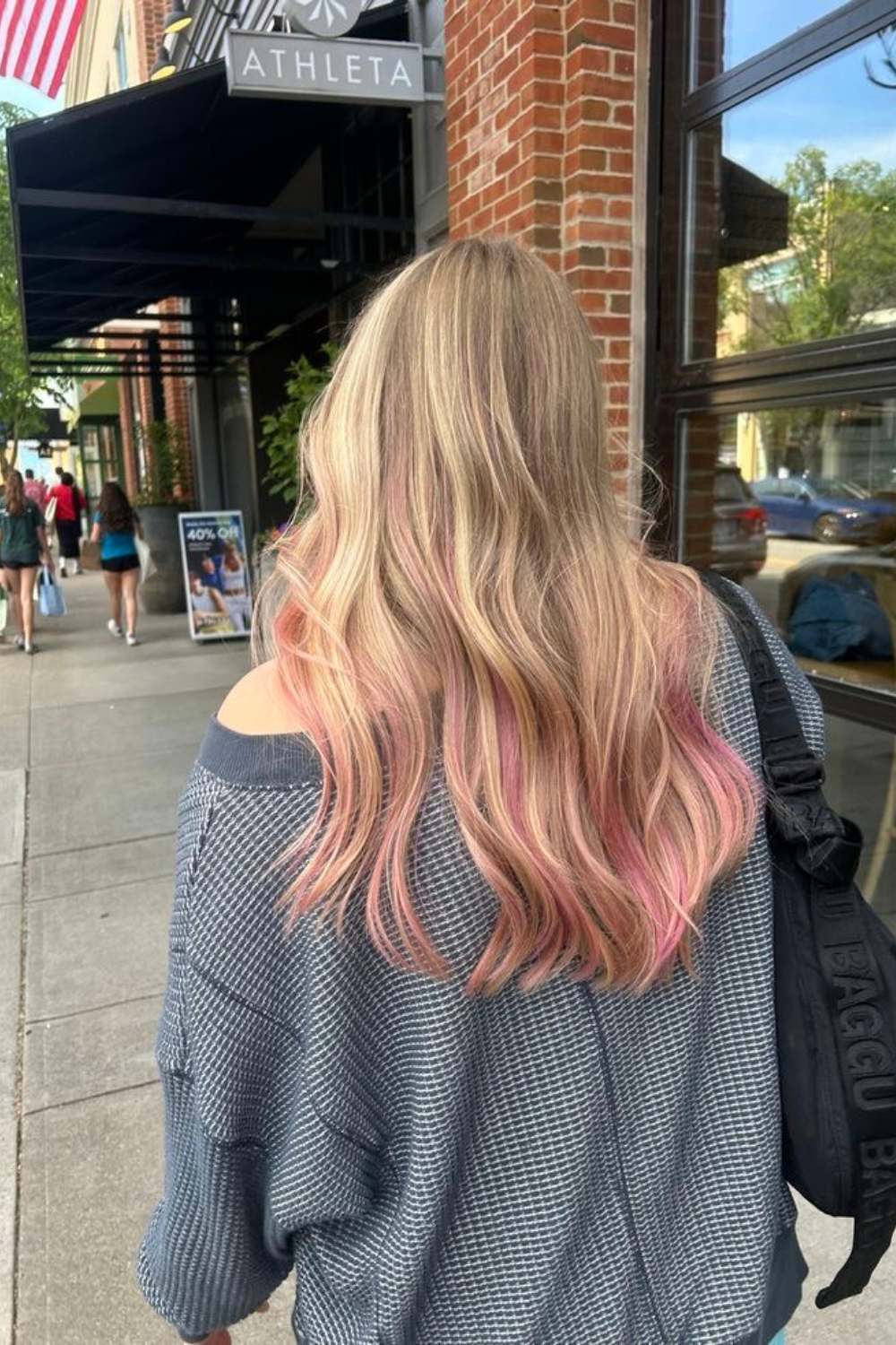 Blonde hair with pastel pink ends for a playful twist