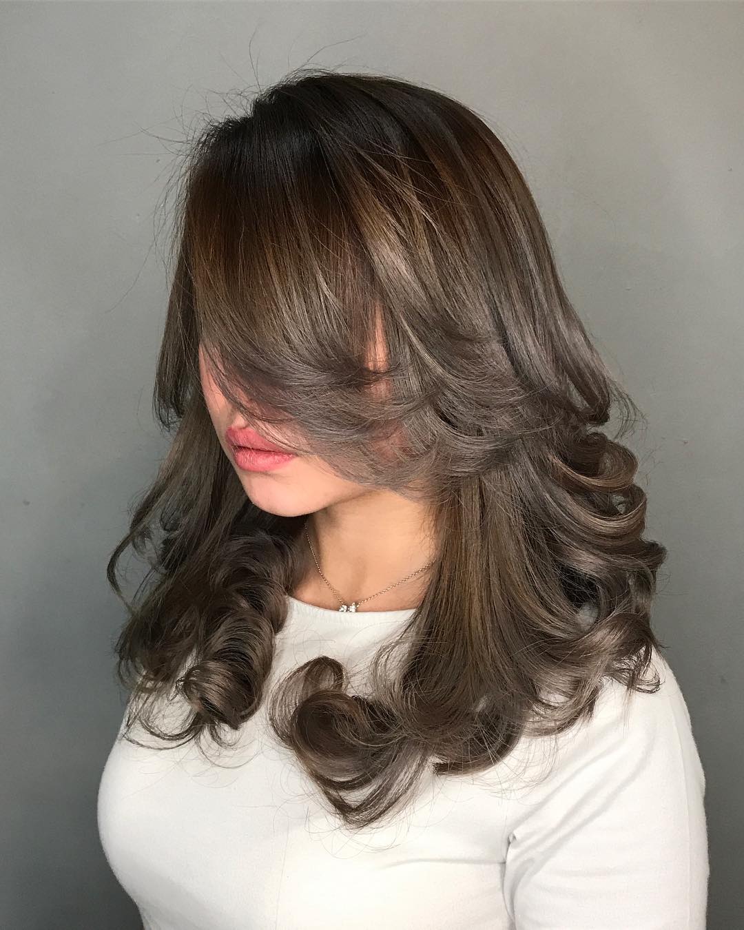 Ash brown hair with soft curls for elegance