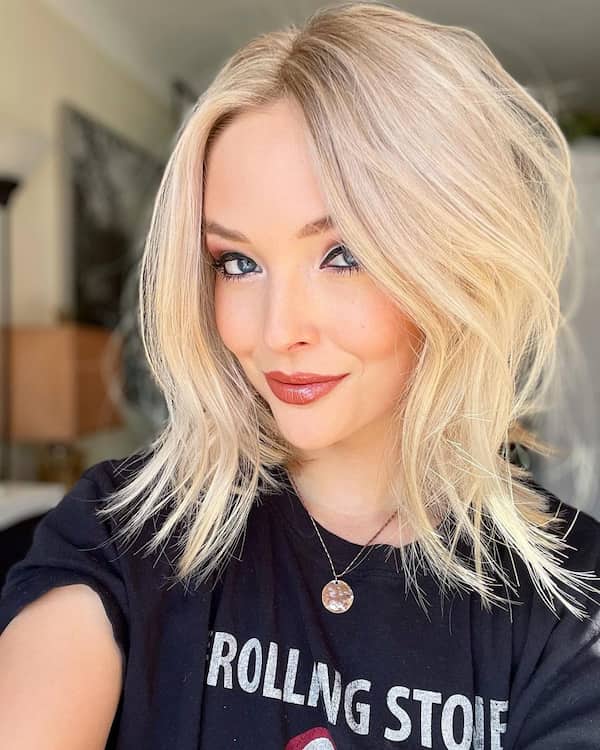 Choppy blonde bob, textured finish, short length