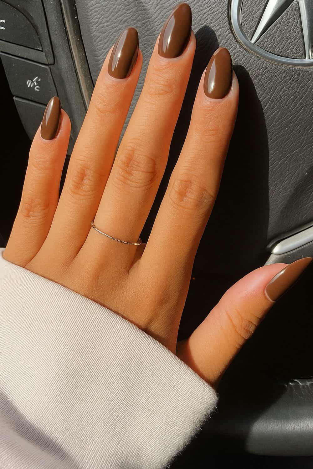 Rich chocolate brown nails, warm fall manicure.