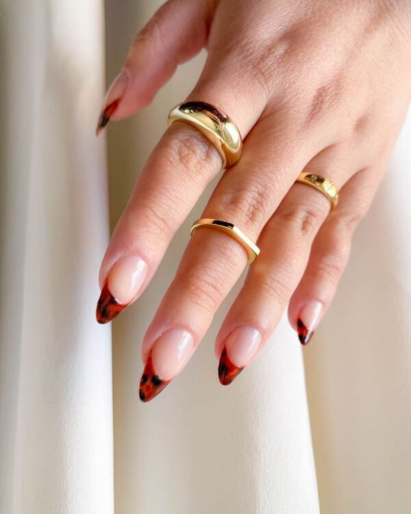 Fiery tortoiseshell stiletto tips with gold flecks.