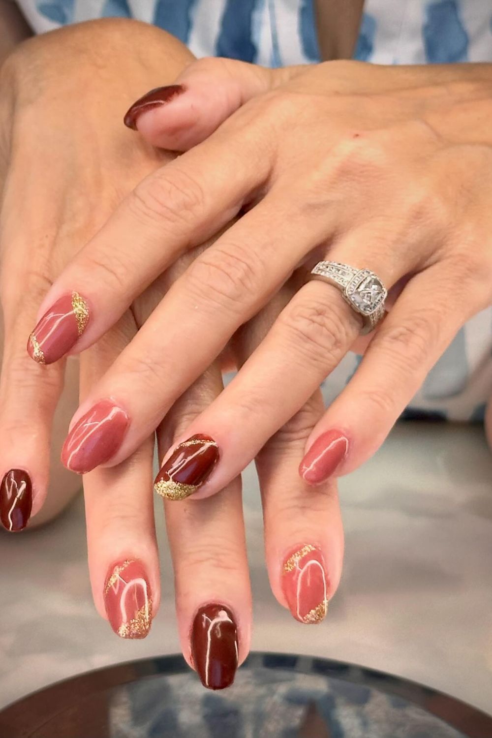 Marble and gold design on medium coffin nails.