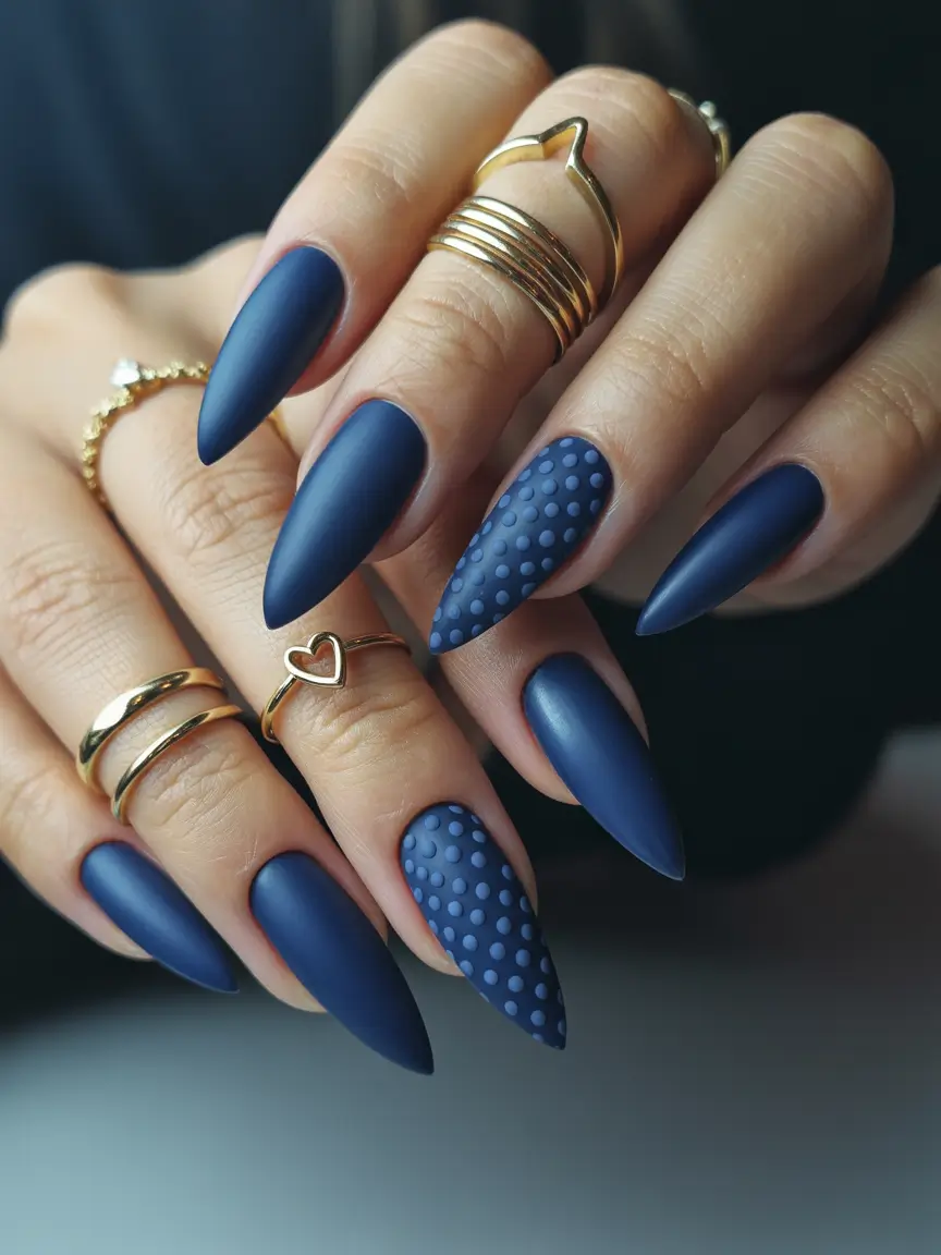 Matte navy stiletto nails, textured accent, bold fall fashion