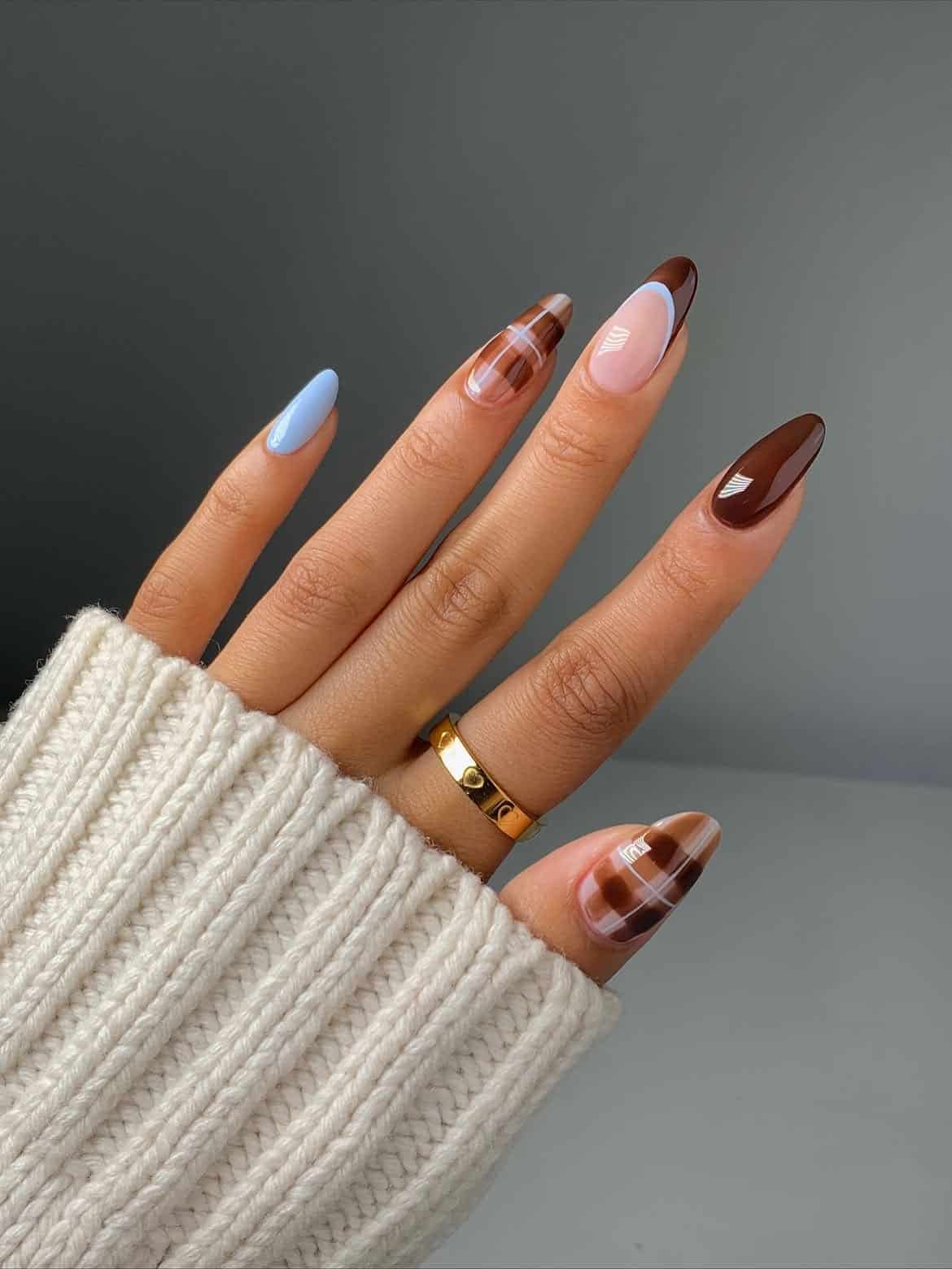 Almond nails with abstract plaid, warm fall tones