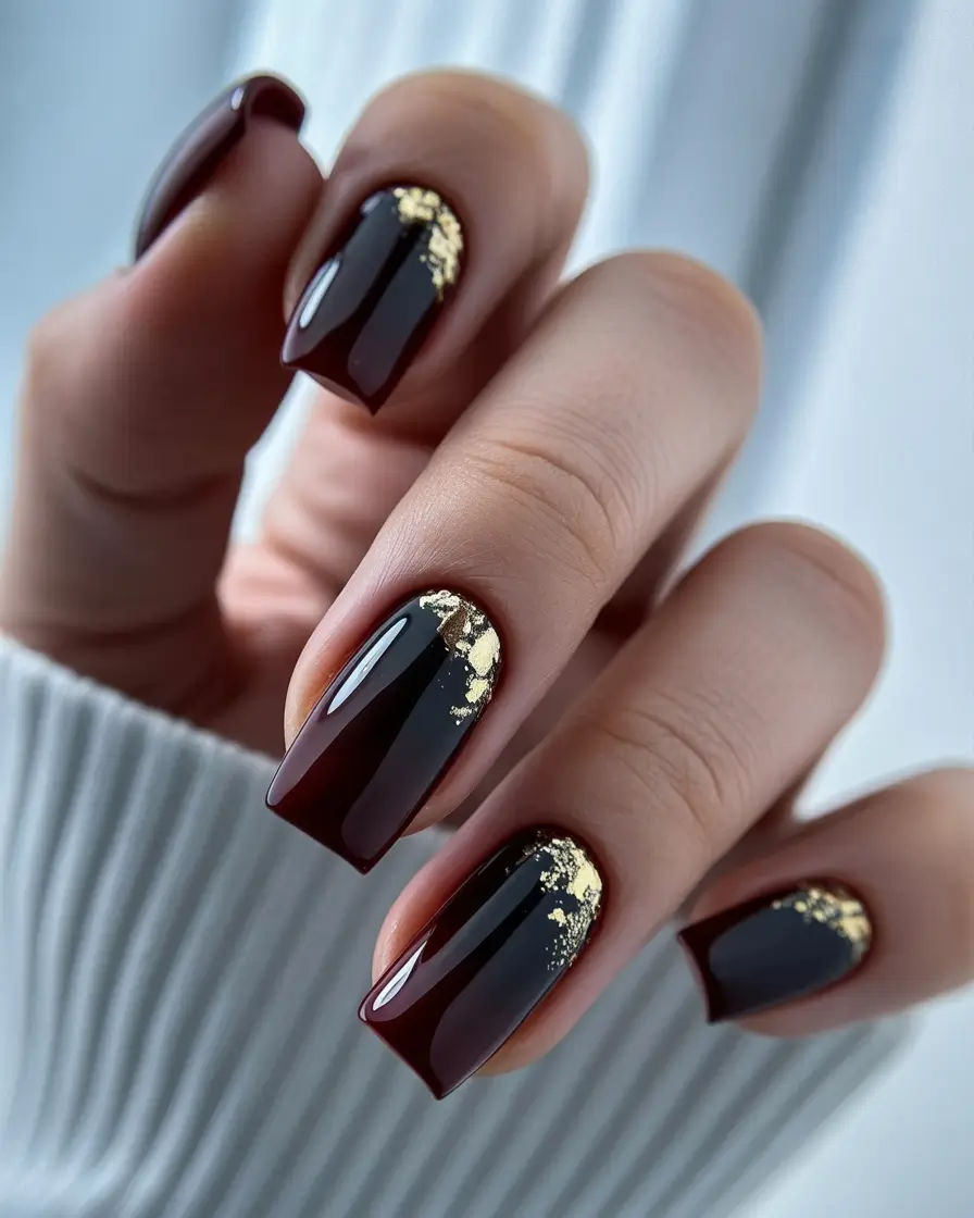 Burgundy square nails with gold leaf accents