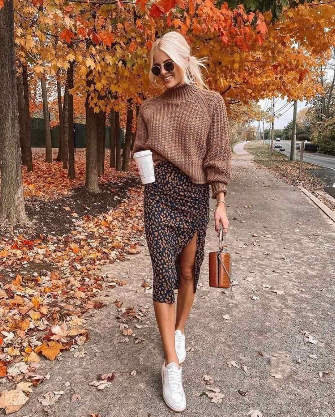 Chunky sweater with floral skirt and sneakers
