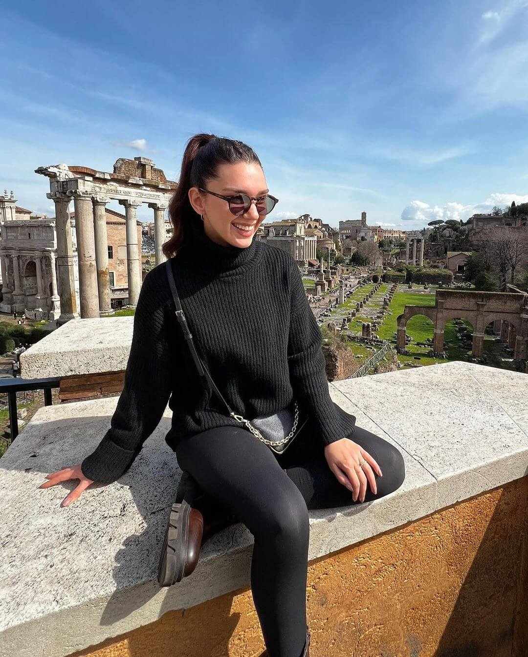 Black sweater with leggings and sunglasses