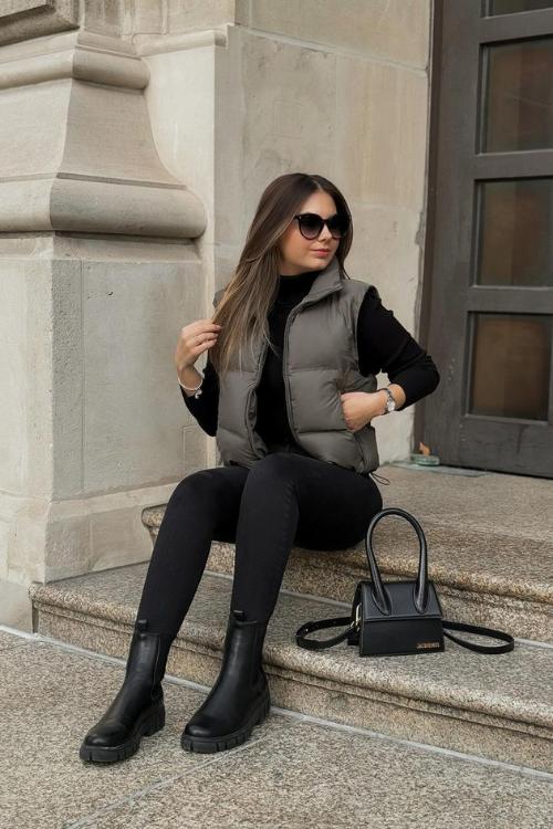 Puffer vest with black sweater and boots