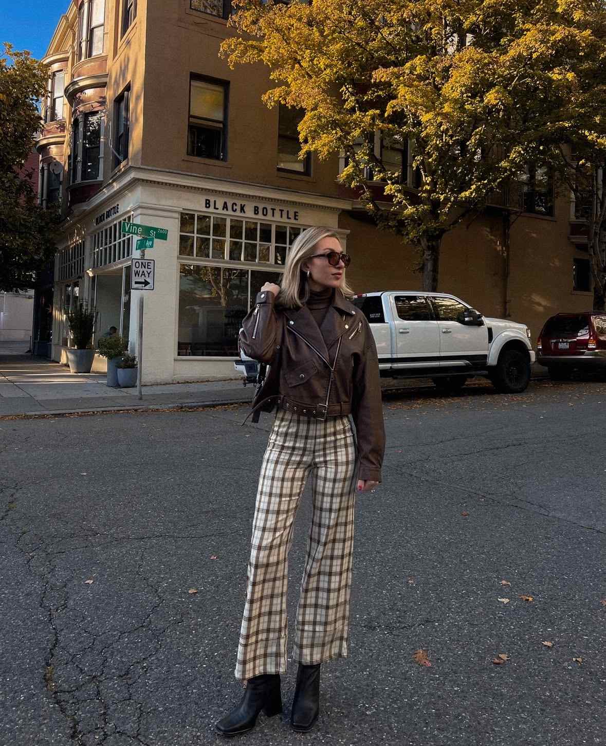Plaid pants with leather jacket and boots