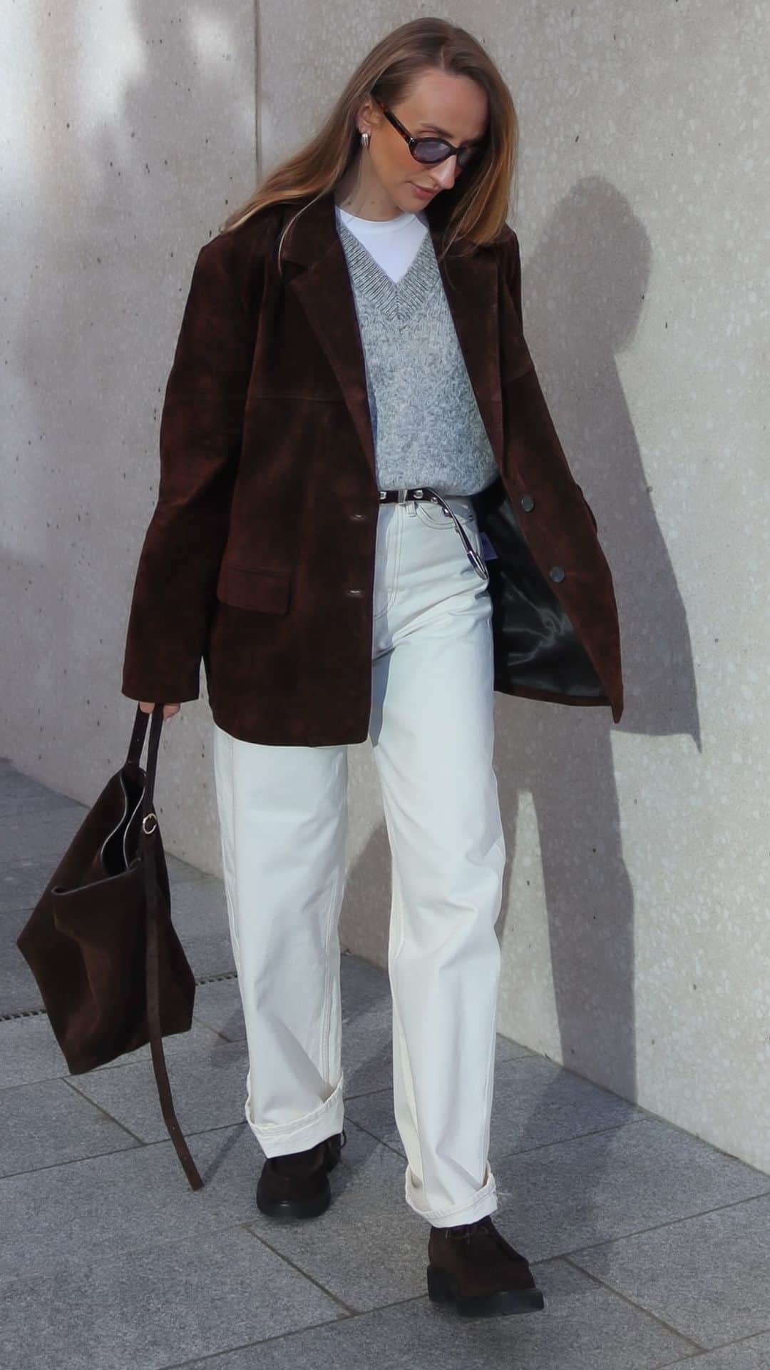 Brown blazer with white pants and boots