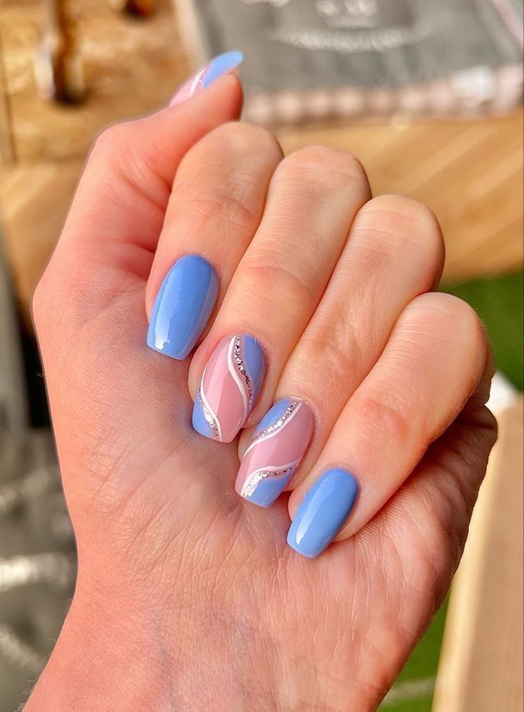 Wave pattern blue nails with square shape, ideal for artistic and creative styles.