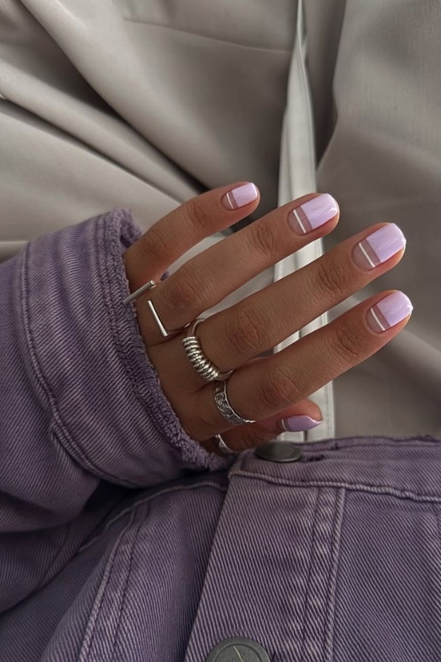 Lavender nails with white line accents, ideal for creative and minimalist styles.