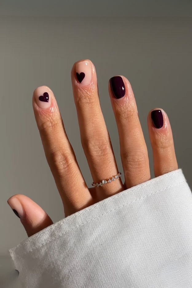 Contrasting heart nail art on square nails, ideal for romantic and bold styles.
