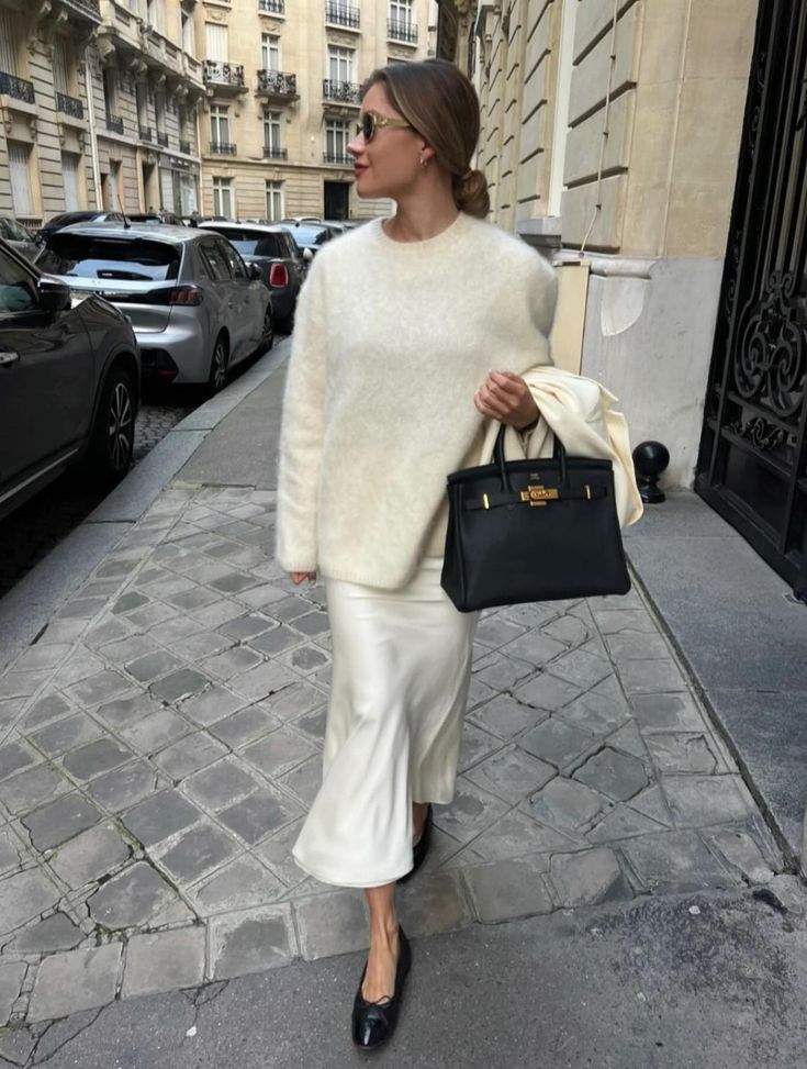Cream sweater with silk skirt and flats