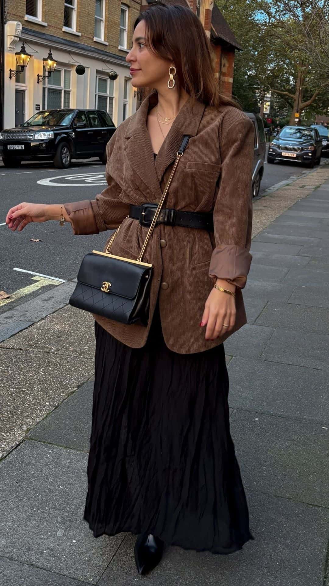 Brown corduroy blazer with black pleated skirt