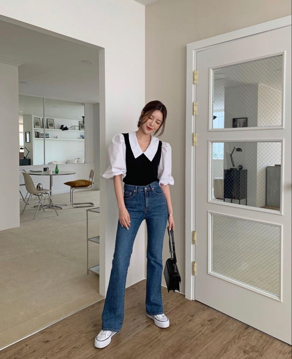 Layered look with jeans and vest
