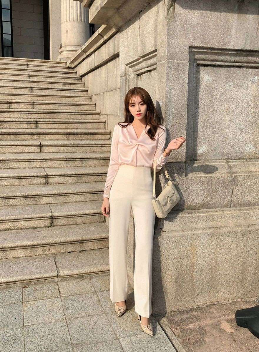 Silk blouse with cream trousers