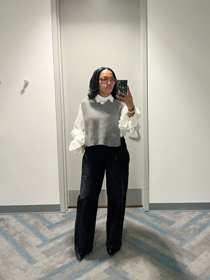 Grey vest with white shirt and black pants