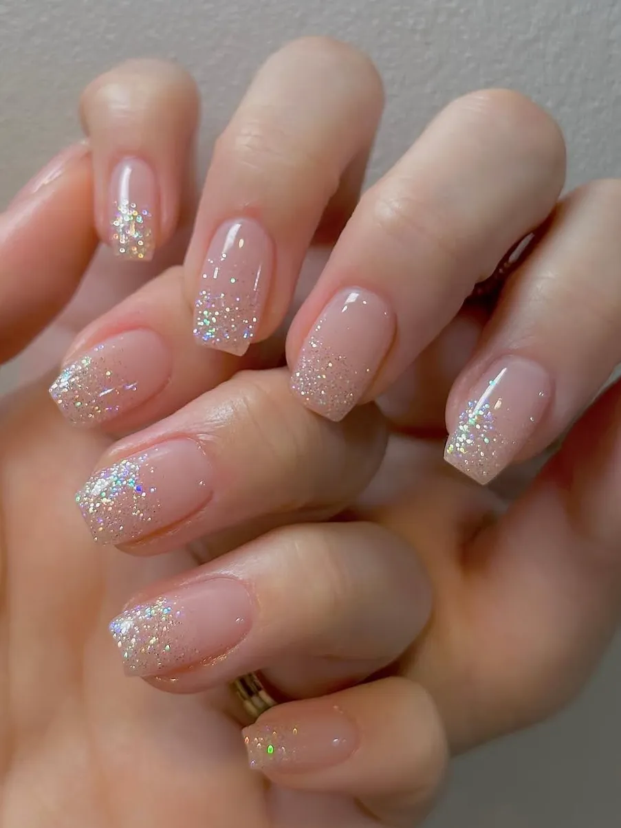Delicate glitter French tip nails for a chic touch