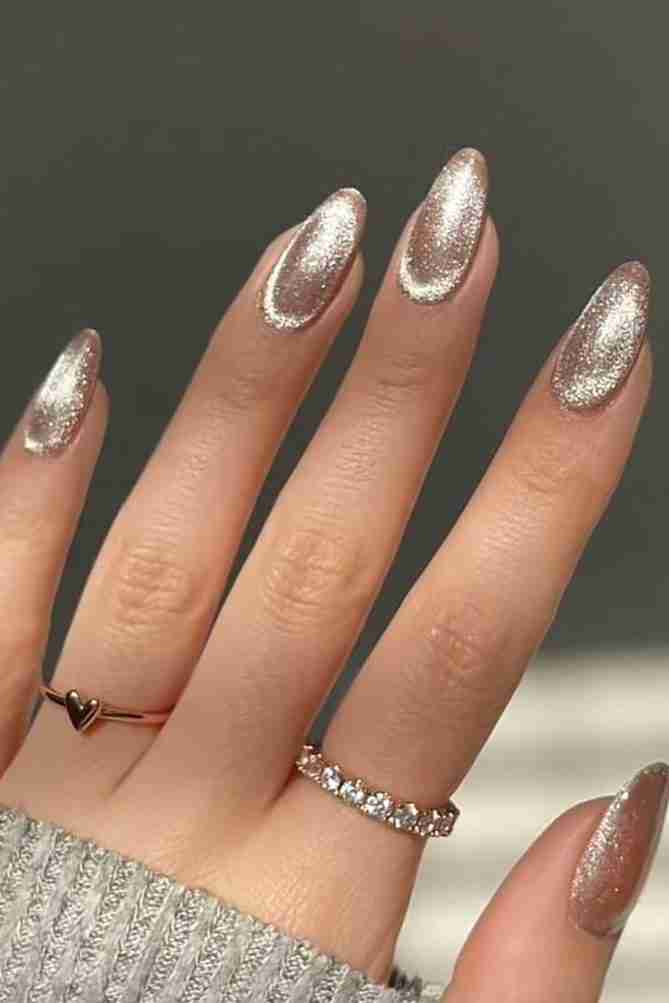 Silver holographic almond nails with a futuristic twist