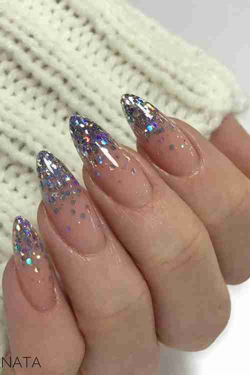 Silver glitter ombre on nude base with almond shape
