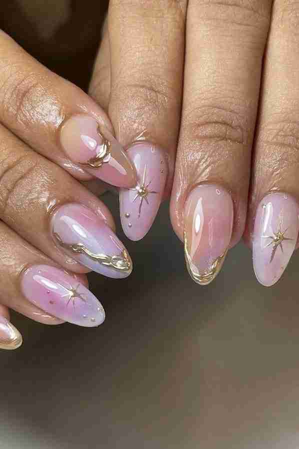 Pastel pink nails with gold stars