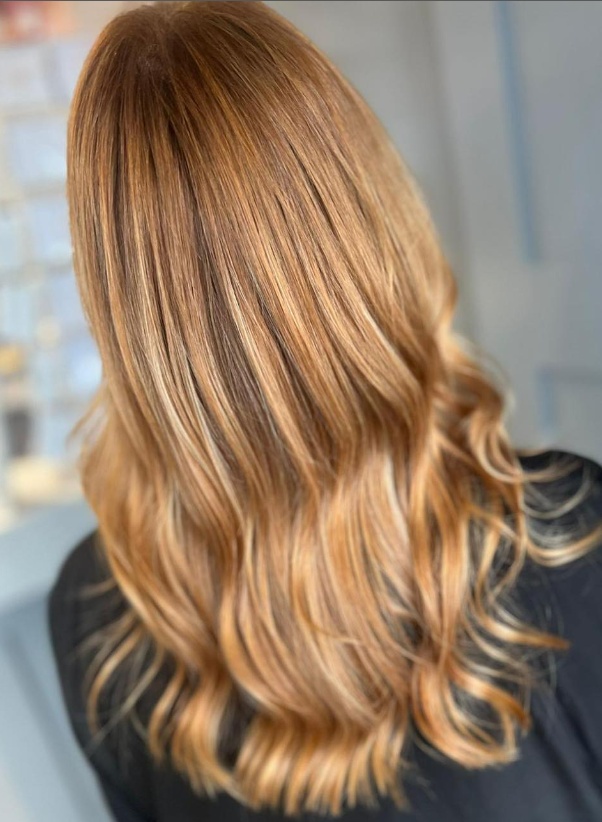 Warm honey lowlights on light brown hair