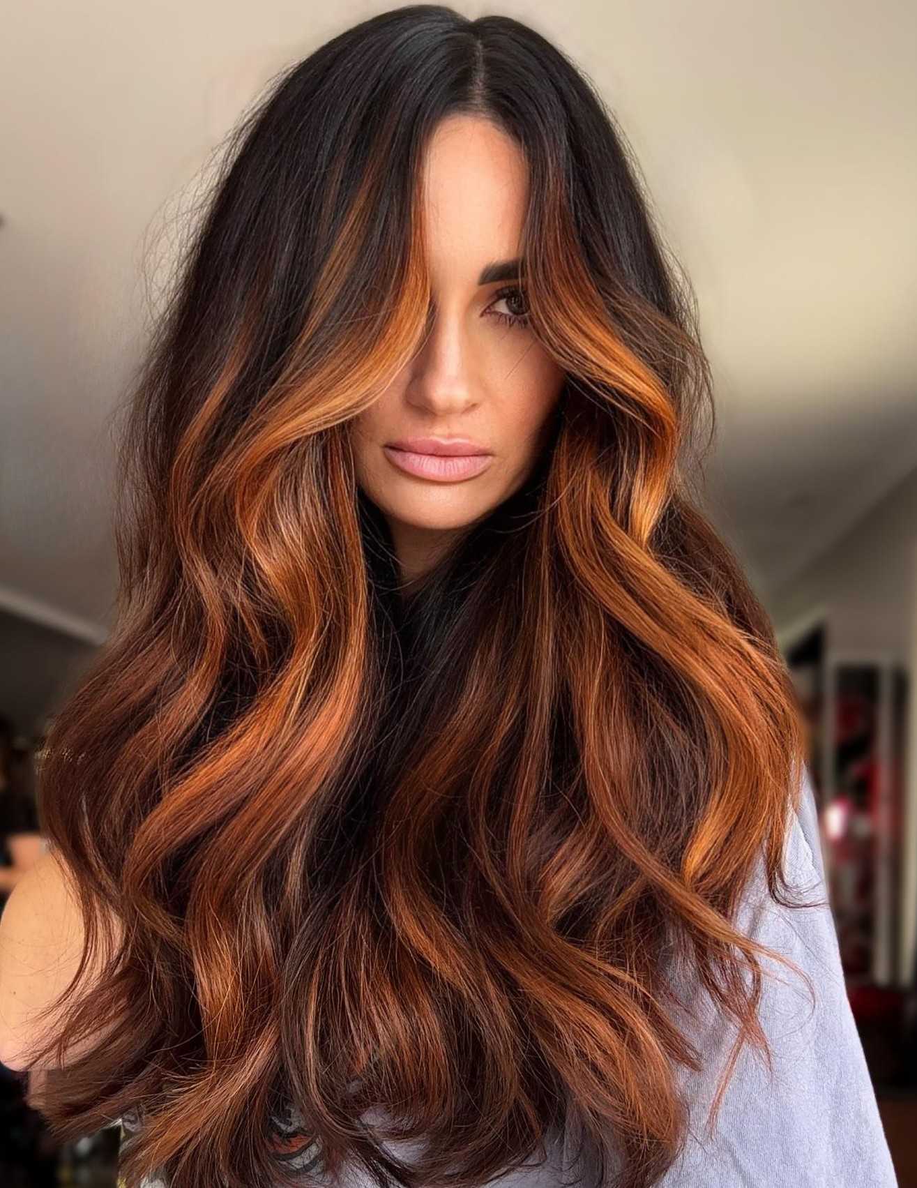 Long auburn hair with voluminous waves
